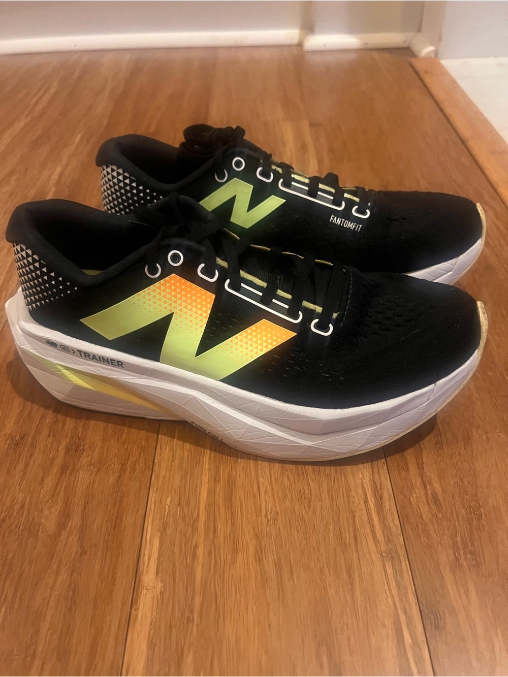 New Balance Black Sneakers with Neon Yellow-Orange N Logo